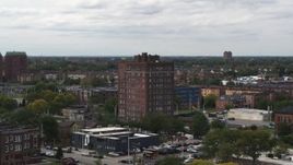 5.7K aerial stock footage of circling a brick apartment building, Detroit, Michigan Aerial Stock Footage | DX0002_190_047