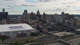 5.7K aerial stock footage flying by football and baseball stadiums with view of skyline, Downtown Detroit, Michigan Aerial Stock Footage | DX0002_191_008