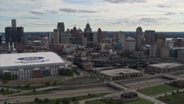 5.7K aerial stock footage the skyline behind Ford Field and Comerica Park stadiums, Downtown Detroit, Michigan Aerial Stock Footage | DX0002_191_010