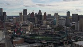 5.7K aerial stock footage of descending by Comerica Park baseball stadium and skyline, Downtown Detroit, Michigan Aerial Stock Footage | DX0002_191_015