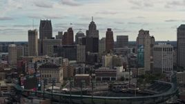 5.7K aerial stock footage of the downtown skyline while flying by baseball stadium, Downtown Detroit, Michigan Aerial Stock Footage | DX0002_191_020