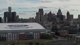 5.7K aerial stock footage focus on downtown skyline, flyby Comerica Park and Ford Field, Downtown Detroit, Michigan Aerial Stock Footage | DX0002_191_027