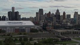 5.7K aerial stock footage stationary view of skyline behind the stadiums, Downtown Detroit, Michigan Aerial Stock Footage | DX0002_191_031