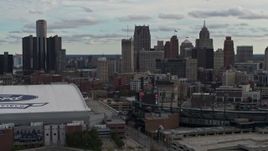 5.7K aerial stock footage approach stadiums, ascend with view of the skyline in Downtown Detroit, Michigan Aerial Stock Footage | DX0002_191_034