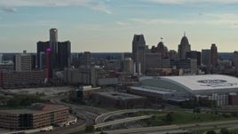 5.7K aerial stock footage fly near football stadium and focus on the skyline at sunset in Downtown Detroit, Michigan Aerial Stock Footage | DX0002_191_038