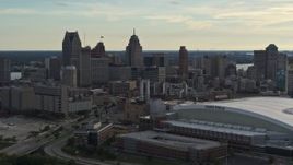 5.7K aerial stock footage of a stationary view of the football stadium and the city skyline at sunset in Downtown Detroit, Michigan Aerial Stock Footage | DX0002_191_044