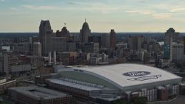 5.7K aerial stock footage flyby Ford Field football stadium and the city skyline at sunset in Downtown Detroit, Michigan Aerial Stock Footage | DX0002_191_045