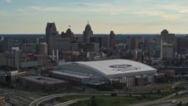 5.7K aerial stock footage of Ford Field football stadium and the city skyline at sunset in Downtown Detroit, Michigan Aerial Stock Footage | DX0002_191_046