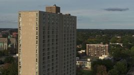 5.7K aerial stock footage of the City Place Detroit apartment building at sunset, Detroit, Michigan Aerial Stock Footage | DX0002_192_001