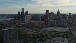 5.7K aerial stock footage slowly flying by tall skyscrapers behind a hotel at sunset, Downtown Detroit, Michigan Aerial Stock Footage | DX0002_192_008