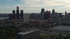 5.7K aerial stock footage slowly passing tall skyscrapers behind a hotel at sunset, Downtown Detroit, Michigan Aerial Stock Footage | DX0002_192_009