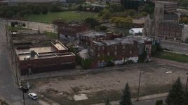 5.7K aerial stock footage circling around an abandoned building at sunset, Detroit, Michigan Aerial Stock Footage | DX0002_192_017