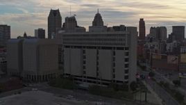 5.7K aerial stock footage of orbiting Frank Murphy Hall of Justice courthouse at sunset, Downtown Detroit, Michigan Aerial Stock Footage | DX0002_192_025