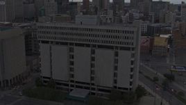 5.7K aerial stock footage of an orbit of Frank Murphy Hall of Justice at sunset, Downtown Detroit, Michigan Aerial Stock Footage | DX0002_192_026