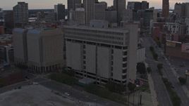 5.7K stock footage aerial of the Frank Murphy Hall of Justice while descending at sunset, Downtown Detroit, Michigan Aerial Stock Footage | DX0002_192_029