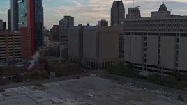 5.7K aerial stock footage ascend while focusing on the Wayne County Jail Division 1 building at sunset, Downtown Detroit, Michigan Aerial Stock Footage | DX0002_192_032