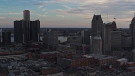 5.7K aerial stock footage of flying by skyscrapers at sunset to reveal a hotel, Downtown Detroit, Michigan Aerial Stock Footage | DX0002_192_036