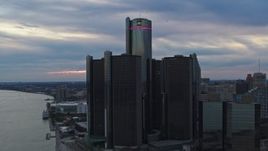 5.7K aerial stock footage approach and orbit riverfront skyscraper at sunset, Downtown Detroit, Michigan Aerial Stock Footage | DX0002_192_039