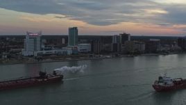 5.7K aerial stock footage of the city skyline and oil tankers on the river, Windsor, Ontario, Canada, sunset Aerial Stock Footage | DX0002_192_046