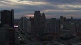 5.7K aerial stock footage stationary view of skyscrapers at sunset, Downtown Detroit, Michigan Aerial Stock Footage | DX0002_192_051
