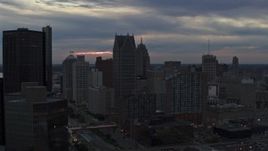 5.7K aerial stock footage flyby skyscrapers at sunset, seen from GM Renaissance Center, Downtown Detroit, Michigan Aerial Stock Footage | DX0002_192_054