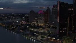5.7K aerial stock footage orbit a group of tall skyscrapers at twilight, reveal GM Renaissance Center, Downtown Detroit, Michigan Aerial Stock Footage | DX0002_193_008