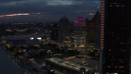 5.7K aerial stock footage flyby GM Renaissance Center at twilight, reveal entrance to tunnel, Downtown Detroit, Michigan Aerial Stock Footage | DX0002_193_010