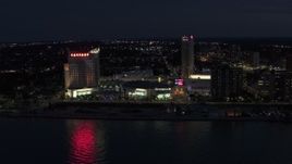 5.7K aerial stock footage stationary view of Caesar Windsor hotel and casino at night, Windsor, Ontario, Canada Aerial Stock Footage | DX0002_193_014