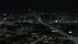 5.7K aerial stock footage flying by Grand River Avenue with view of skyline at night, Downtown Detroit, Michigan Aerial Stock Footage | DX0002_193_024