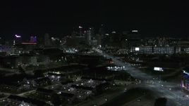 5.7K aerial stock footage flying near Grand River Avenue while focused on skyline at nighttime, Downtown Detroit, Michigan Aerial Stock Footage | DX0002_193_025
