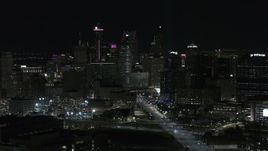 5.7K aerial stock footage of flying by the skyscrapers in the skyline at night, Downtown Detroit, Michigan Aerial Stock Footage | DX0002_193_028