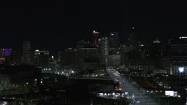 5.7K aerial stock footage fly from Grand River Avenue, focus on skyline at night, Downtown Detroit, Michigan Aerial Stock Footage | DX0002_193_033