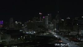 5.7K aerial stock footage of towering skyscrapers in city's skyline at night during descent, Downtown Detroit, Michigan Aerial Stock Footage | DX0002_193_036