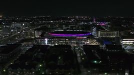 5.7K aerial stock footage approach and fly away from Little Caesars Arena at night, Detroit, Michigan Aerial Stock Footage | DX0002_193_037