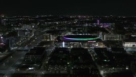5.7K aerial stock footage of approaching Little Caesars Arena at night, Detroit, Michigan Aerial Stock Footage | DX0002_193_038