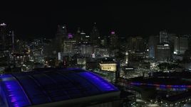 5.7K aerial stock footage of the city's skyline at night, seen from the stadiums, Downtown Detroit, Michigan Aerial Stock Footage | DX0002_193_041