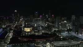 5.7K aerial stock footage approach the city's skyline and baseball stadium at night, Downtown Detroit, Michigan Aerial Stock Footage | DX0002_193_043