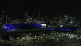5.7K aerial stock footage ascend past stadiums for view of skyline at night, Downtown Detroit, Michigan Aerial Stock Footage | DX0002_193_045