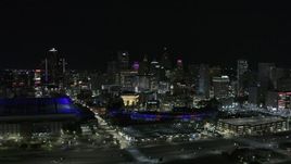 5.7K aerial stock footage slowly approach the skyline, Ford Field and Comerica Park at night, Downtown Detroit, Michigan Aerial Stock Footage | DX0002_193_048