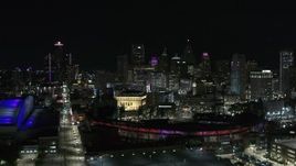 5.7K aerial stock footage approach the skyline and Comerica Park at night before descent, Downtown Detroit, Michigan Aerial Stock Footage | DX0002_193_049