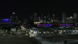 5.7K aerial stock footage descend near Comerica Park at night with view of skyline, Downtown Detroit, Michigan Aerial Stock Footage | DX0002_193_050