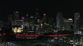 5.7K aerial stock footage descending by Comerica Park and skyline at night, Downtown Detroit, Michigan Aerial Stock Footage | DX0002_193_058