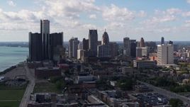 5.7K aerial stock footage of passing by GM Renaissance Center and the city's skyline, Downtown Detroit, Michigan Aerial Stock Footage | DX0002_194_006