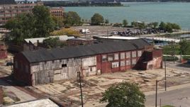 5.7K aerial stock footage of orbiting an abandoned factory building in Detroit, Michigan Aerial Stock Footage | DX0002_194_017