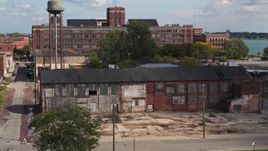 5.7K aerial stock footage reverse view of an abandoned factory building in Detroit, Michigan Aerial Stock Footage | DX0002_194_019