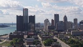 5.7K aerial stock footage of descending past towering GM Renaissance Center and the skyline in Downtown Detroit, Michigan Aerial Stock Footage | DX0002_194_025