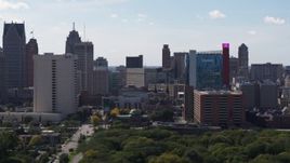 5.7K aerial stock footage of churches between office tower and the hotel and casino, Downtown Detroit, Michigan Aerial Stock Footage | DX0002_194_042
