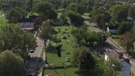 5.7K aerial stock footage of circling the Heidelberg Project art display in Detroit, Michigan Aerial Stock Footage | DX0002_195_005