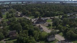 5.7K aerial stock footage ascend over urban homes to orbit a church on Mt Elliott Street, Detroit, Michigan Aerial Stock Footage | DX0002_195_013