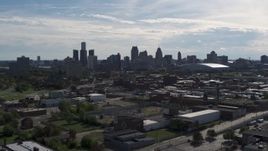 5.7K aerial stock footage of the city's skyline seen from brick industrial buildings, Downtown Detroit, Michigan Aerial Stock Footage | DX0002_195_016